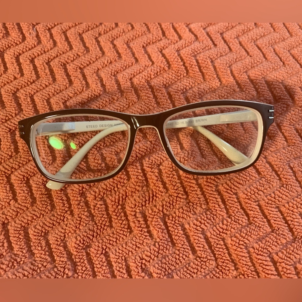 White and brown eyeglasses with a case